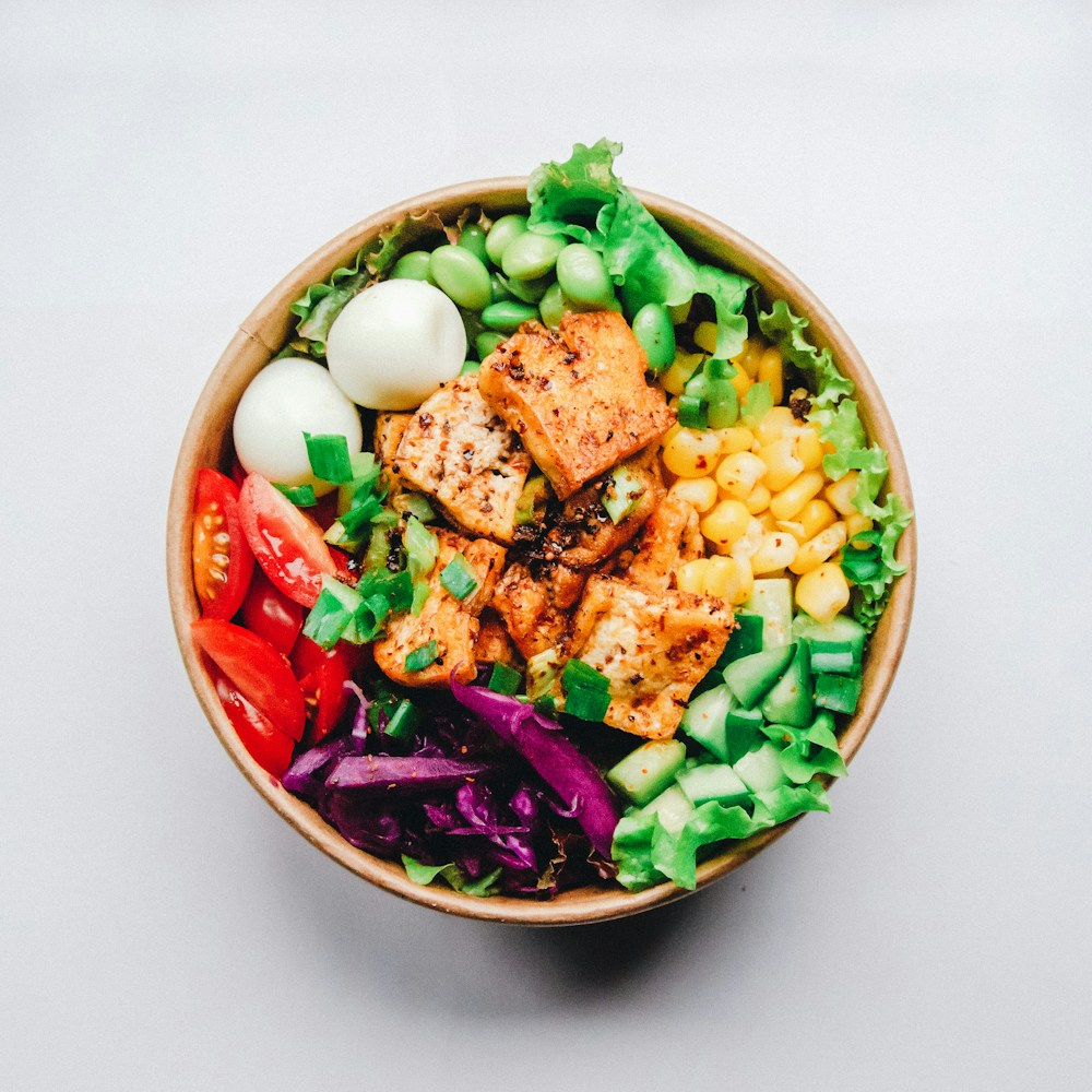 Healthy nutrient-dense lunch bowl with tomatoes and seeds